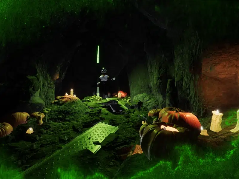 Citrouilles géantes, bougies et pierre tombale dans une grotte de Ganymède en version Halloween, escape game VR The Edge Paris